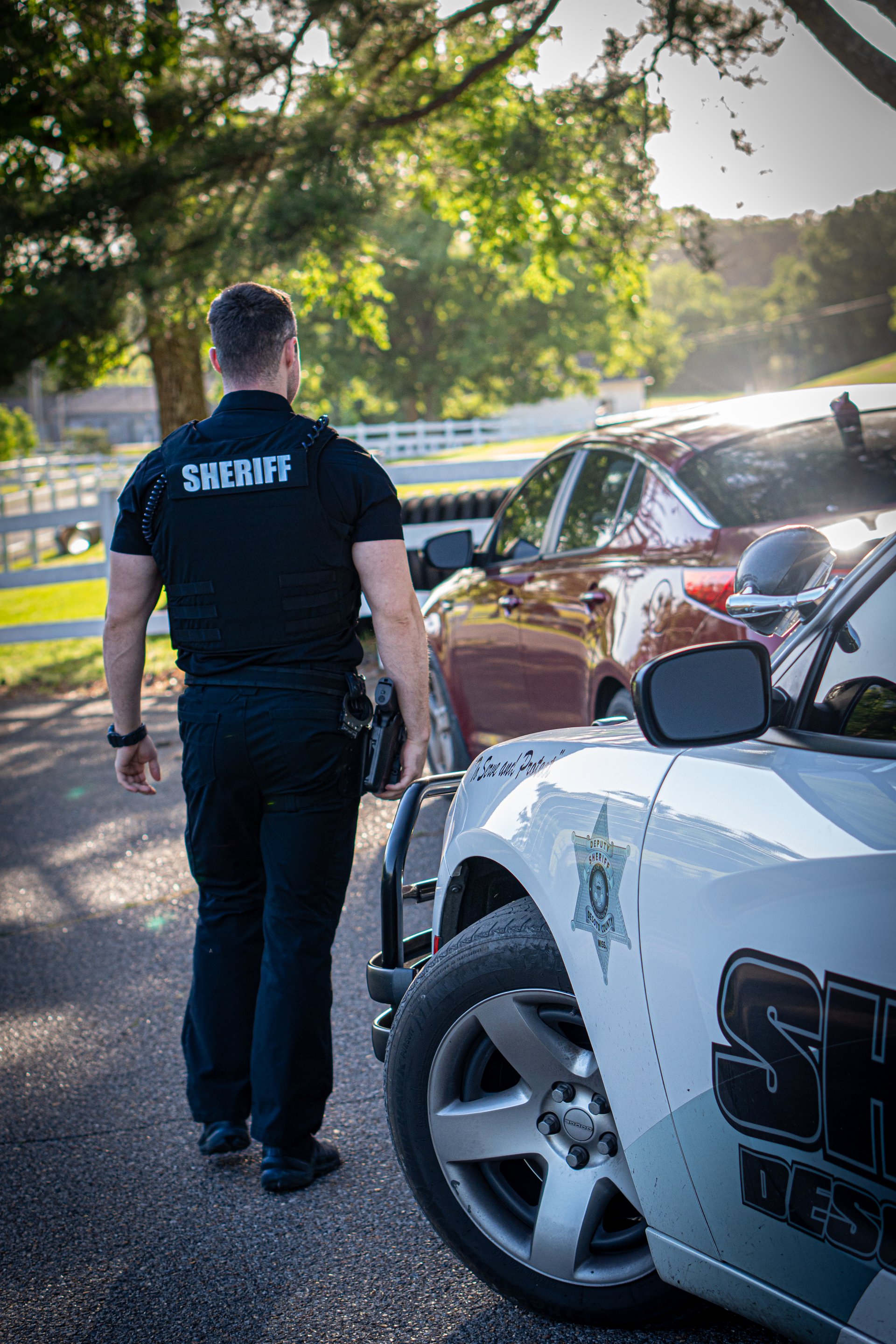 A DeSoto County deputy approaching a stopped vehicle during a field contact