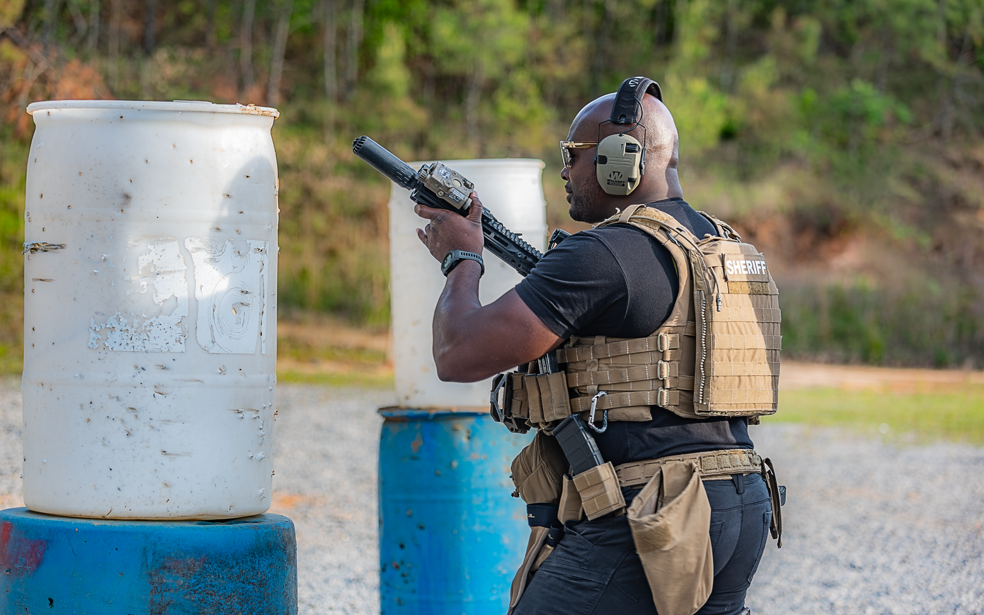 A DeSoto County deputy in tactical gear training with a rifle at the range